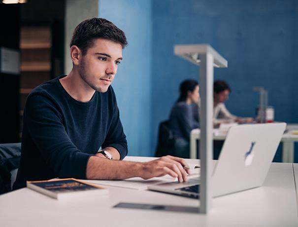 Student works on laptop